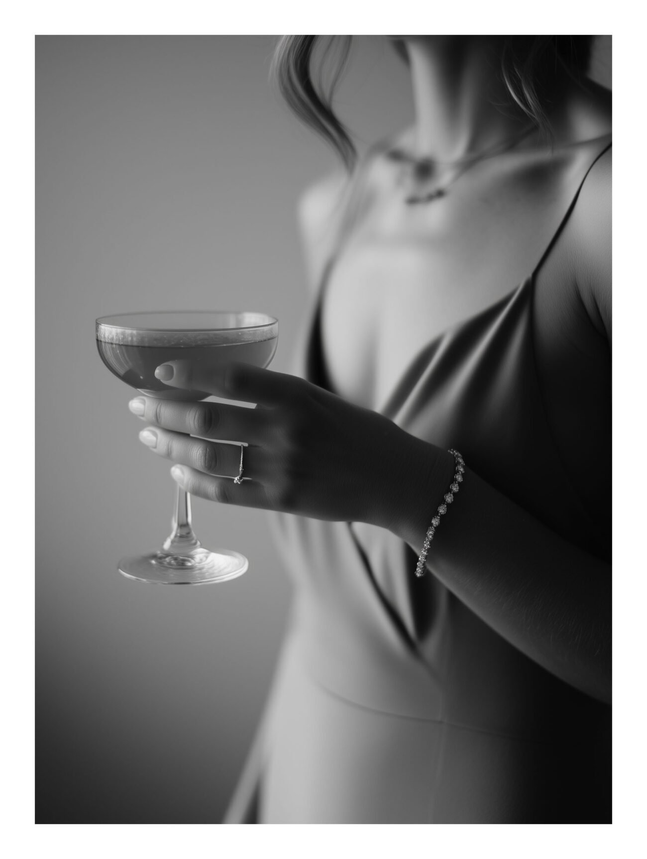 Woman Holding Champagne – Black and White Photography Poster
